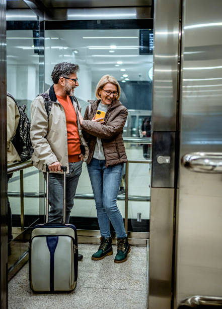 istock Mature couple of passengers in the elevator 2070926341