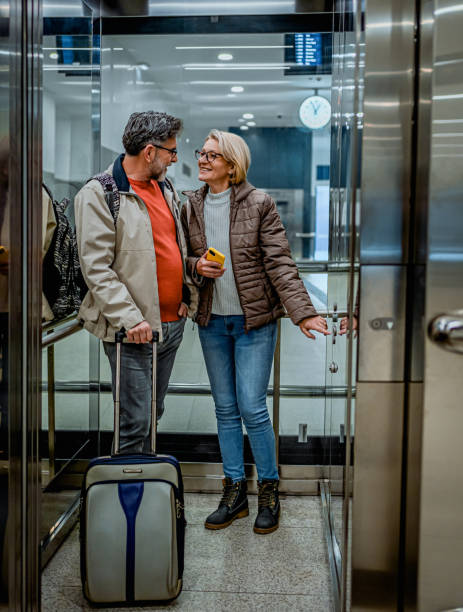 istock Mature couple of passengers in the elevator 2070929122