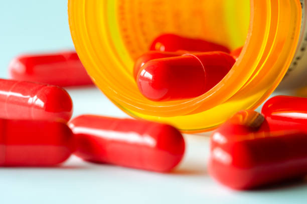 Cephalexin Capsules Spilled from a Prescription Bottle