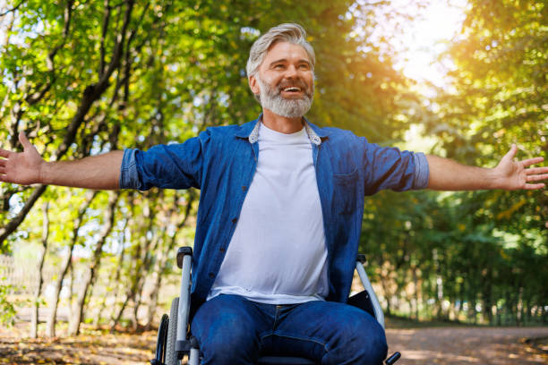 istock Grasping Serenity: Disabled Man in Wheelchair at Park 2070984936