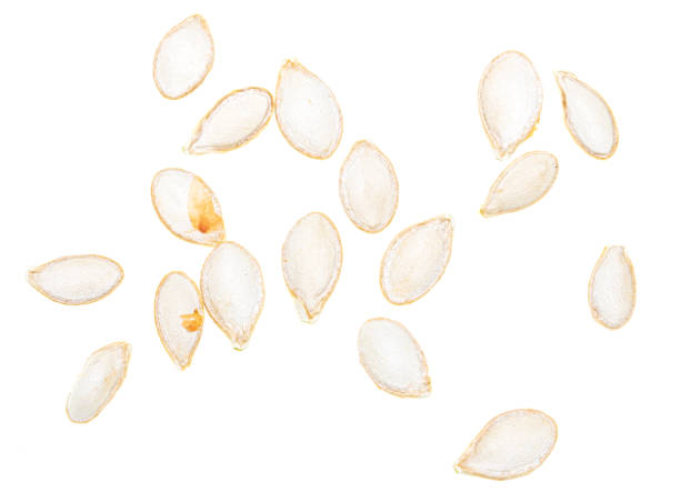 istock Close-up of pumpkin seeds on a white background. Macro 2070984938