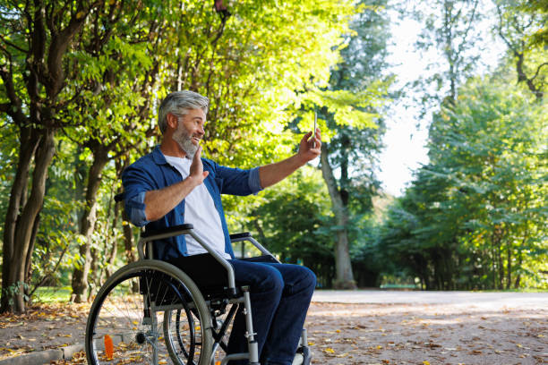 istock Wheelchair Selfie: Embracing Nature's Beauty from the Park 2070986097