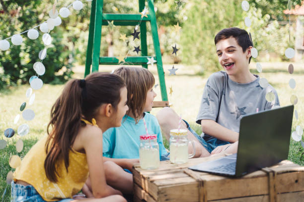 istock Happy children celebrating birthday online at backyard. 2070991540