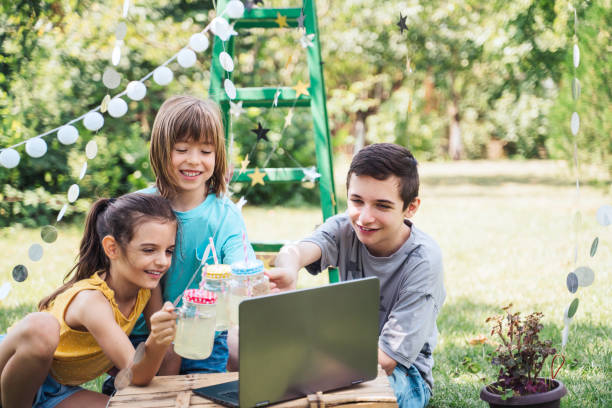 istock Happy children celebrating birthday online at backyard. 2070991564