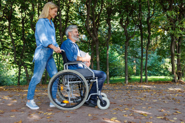 istock Unwavering Friendship: Park Outing with Wheelchair 2070999967
