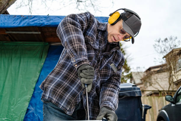 Senior male hobby carpenter working outdoors stock photo