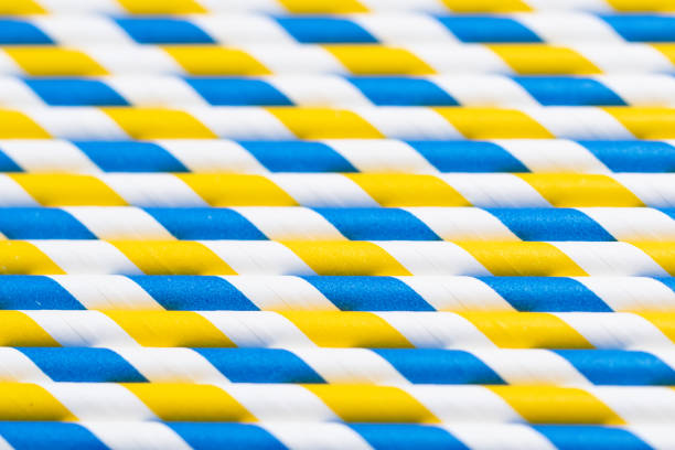 Full frame photo of blue, white and yellow straws, colors of Ukraine or Sweden