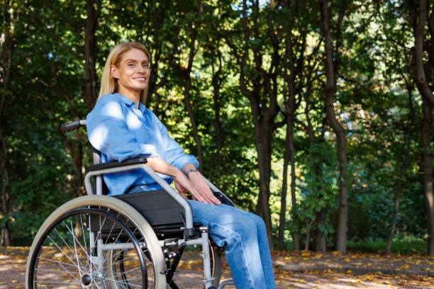istock Rolling Through Bliss: Woman Explores Park in Wheelchair 2071008310