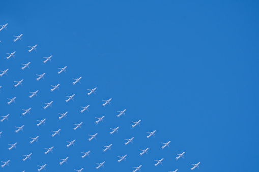 Minimal photo of many airplanes in the sky, the photo can be used as a background with copy space