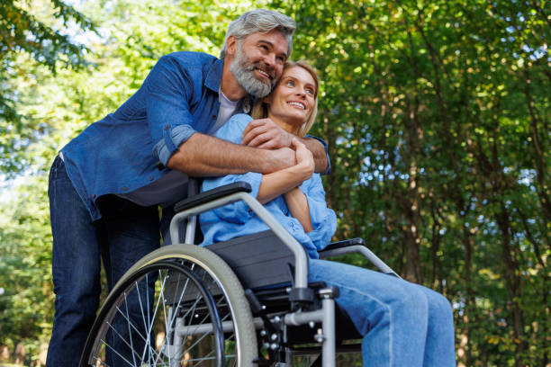 istock Accessible Outdoor Leisure: Wheelchair Users in the Park 2071009377