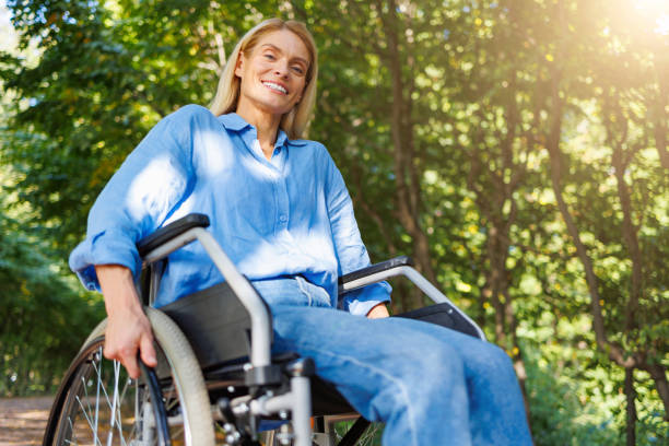 istock Serenity in the Park: Woman in a Wheelchair 2071009990