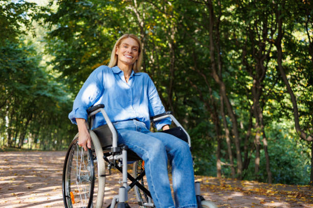 istock Wheelchair User Enjoying Nature's Beauty 2071010375