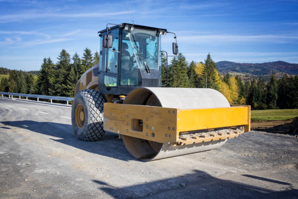 Asphalting in city road. Asphalt paving repairing. Vibrator compactor machine on roadworks. Asphalt road roller on road construction. Road Construction Equipment. Vibration roller on Asphalting.