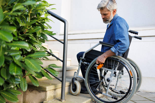 istock Defying Limits: Wheelchair User Conquers Staircase 2071018164