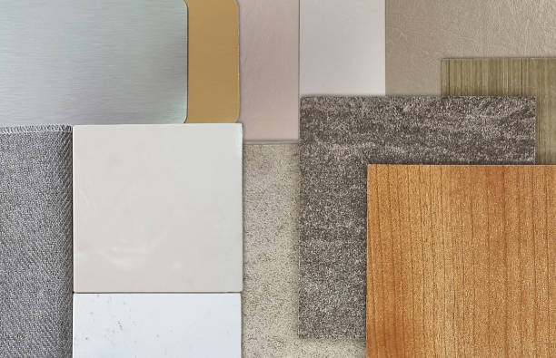 istock close up view of interior material samples including ceramic tiles, quartz, grey drape, silver and gold laminateds, wooden veneers, beige tone leather laminated. luxury cozy interior style. 2071021351