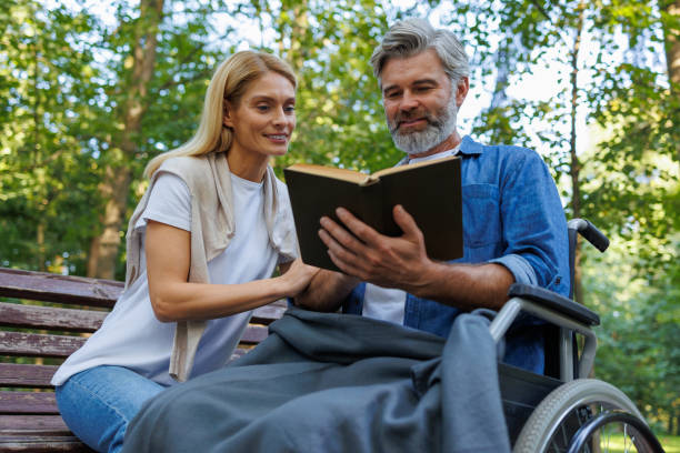 istock Wheelchair Adventures: Park Reading Scene 2071023188