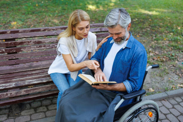 istock Bench Buddies: Enjoying a Book Outdoors 2071023592
