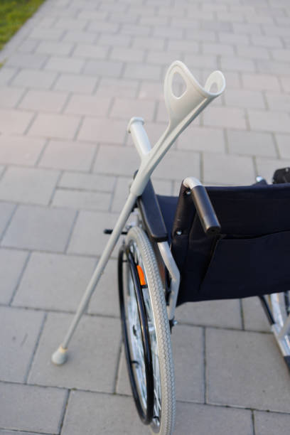 istock Wheelchairs and Crutches Resting Outdoors 2071025725