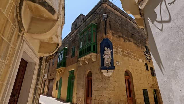 Walking Through Narrow Street In Victoria On Gozo Island