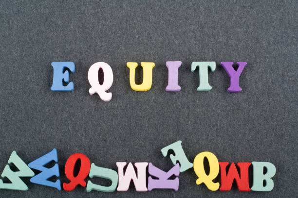 istock EGUITY word on black board background composed from colorful abc alphabet block wooden letters, copy space for ad text. Learning english concept. 2071054983