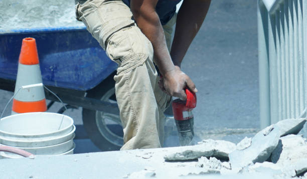 istock manual worker operating drill to repair the road 2071065259