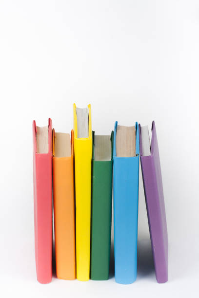 istock Book stacking. Open book, hardback books on white background. Back to school. Copy space for text. 2071065803