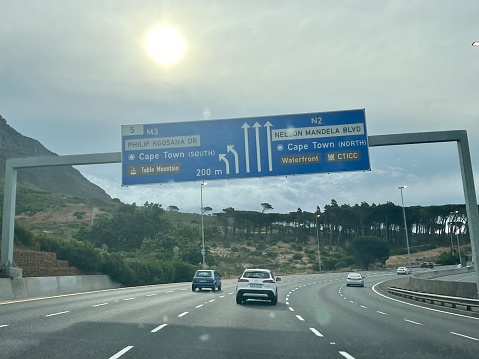 Faro, Portugal - May 4, 2018: Truck passing under a tollgate on the highway on a spring day
