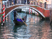 Gondola under the bridges of Venice