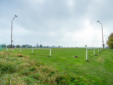 This picture shows the Landscape of Brandenburg, Germany, on October 2011. Abandoned Soccer field in the countryside near Berlin.  It's a cloudy mood.