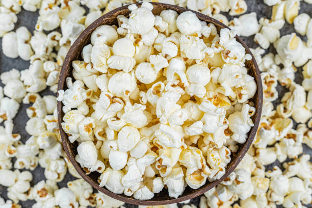 istock Fresh popcorn snacks in a wooden bowl 2071197042
