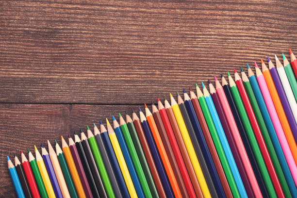 istock Colored pencils on brown wooden table 2071198078