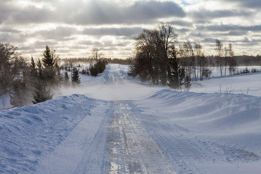 Winter landscape with the road and the forest
