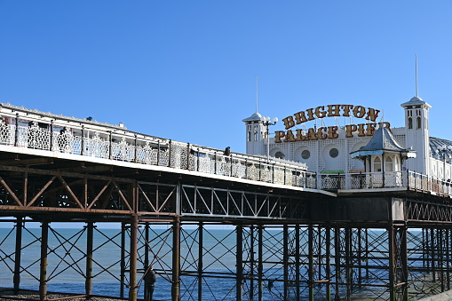 Brighton, United Kingdom – March 06, 2024: Brighton Palace Pier on blue sky background