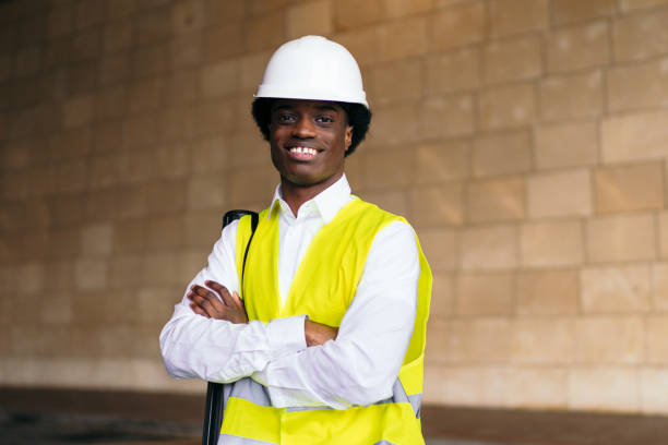 istock Confident African Architect in Yellow Vest at Construction Site 2071249542