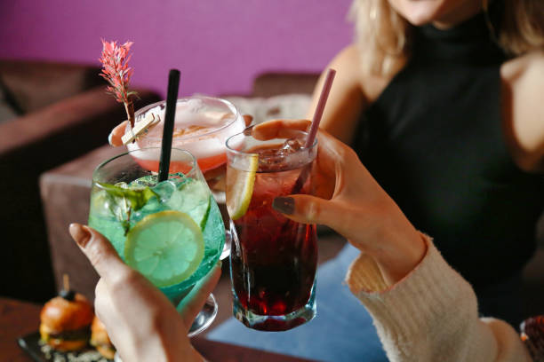istock Group of People Holding Drinks at a Party 2071269655