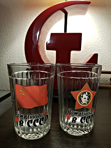 On faceted glasses there are symbols of those who were born in the USSR.