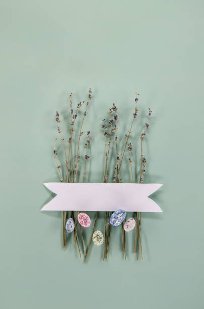 istock Dried lavender, egg shaped candies, white label on a green background. Easter concept. Greeting card design. 2071396441
