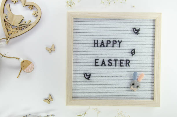 istock Easter composition with letter board, dried flowers, decorations on grey background, minimalistic style 2071401046