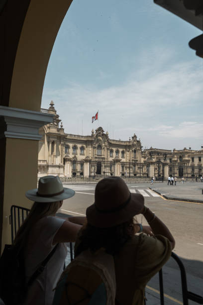 istock Tourists seeing the government palace in lima peru. 2071410317