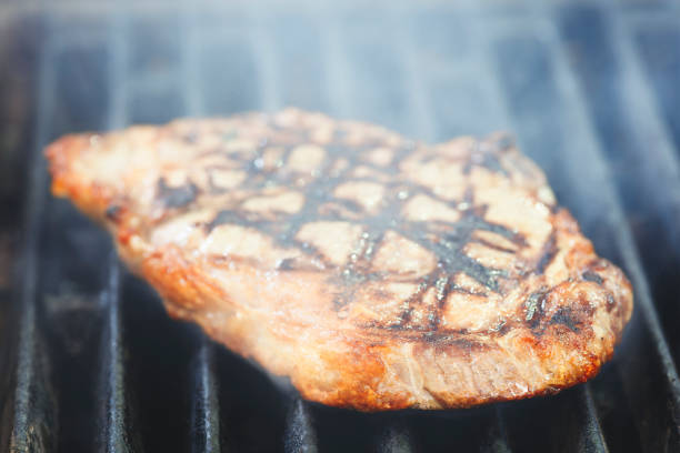 Steak meat grilled with smoke