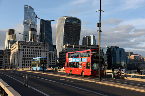 London City financial district with several tall office buildings and a Double Decker Bus. The image was captured during summer season.