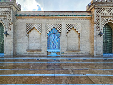 Moroccan style fountain with fine colorful mosaic tiles at the Mohammed V mausoleum in Rabat Morocco