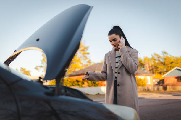 istock Stressed woman calling someone to help her with the car 2071480334