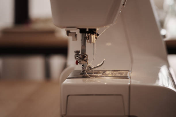 Close-up of a sewing machine needle and thread