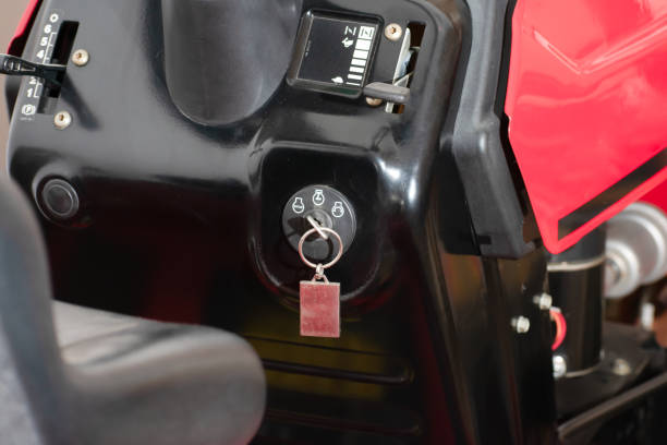 the essential role of a tractor's ignition key in starting up the machinery needed for efficient lawn mowing.