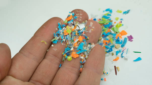 istock Close-up on many microplastic particles in human hand. Concept of plastic pollution with nanoplastics. 2071528489