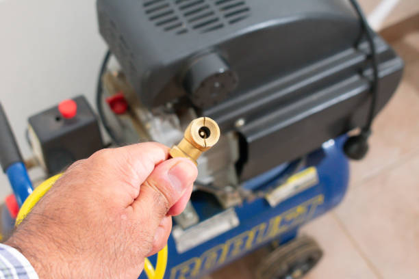 istock Air Compressor Power: A Man Holding Tire Inflator Nozzle 2071528502