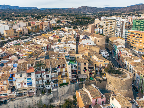 The aerial drone view of Villajoyosa, Spain, captures the picturesque charm of the town's colorful houses against the backdrop of the Mediterranean Sea. Villajoyosa, also known as La Vila Joiosa, is renowned for its vibrant and colorful architecture, creating a captivating visual spectacle that is best appreciated from an aerial perspective.