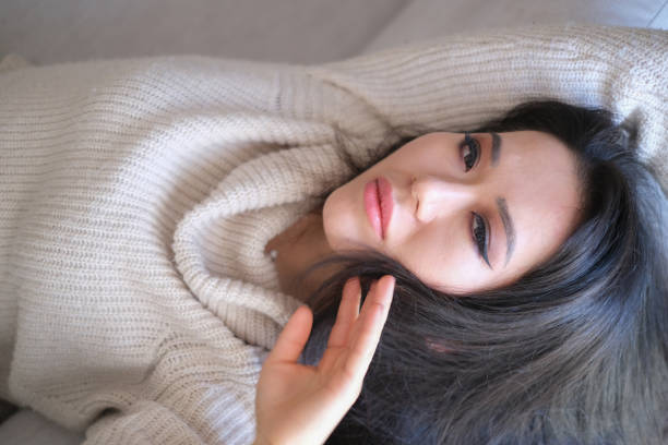 Relaxed woman rest lounge on couch enjoy peaceful day.