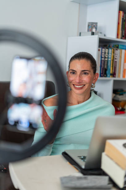 istock Happy pretty student girl watching online training, writing notes 2071588546